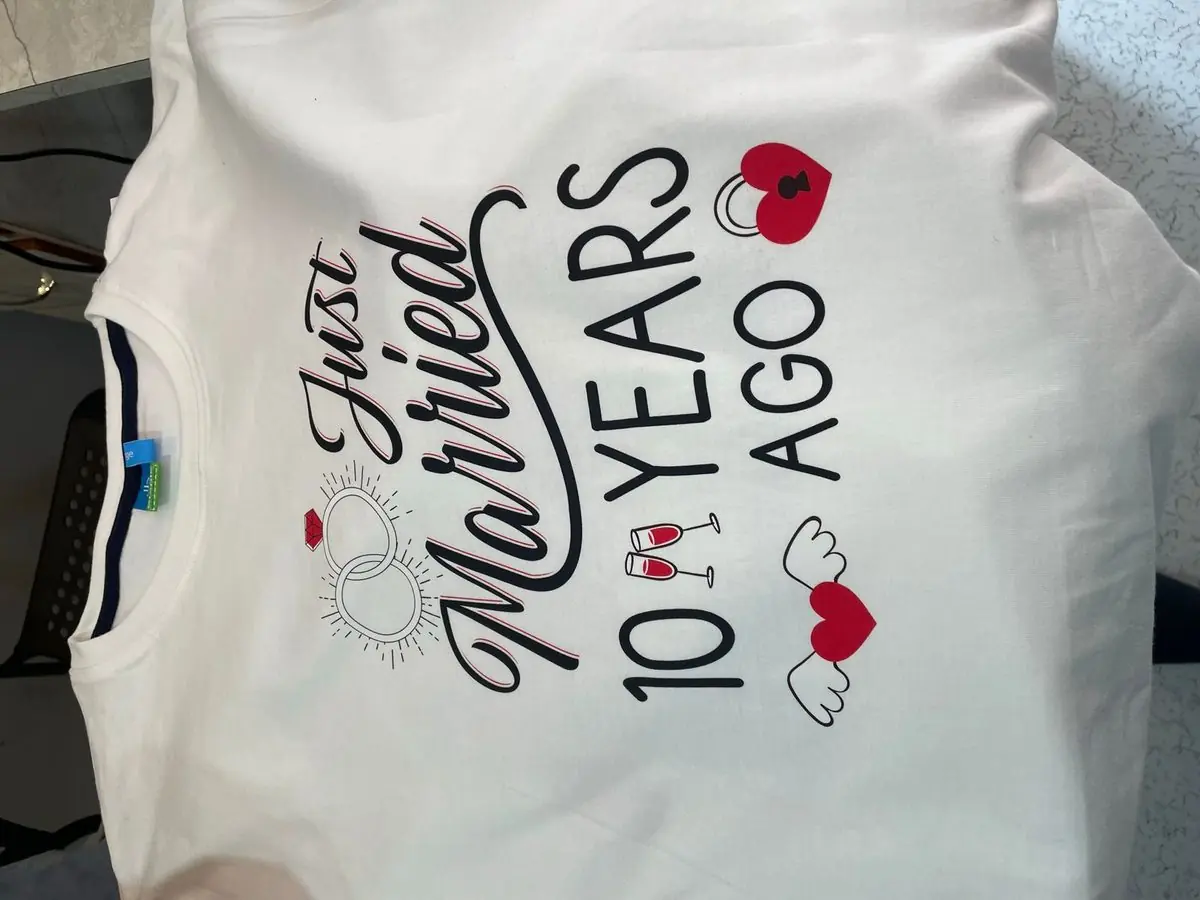 Fine-detail DTF print on a white t-shirt — custom anniversary design